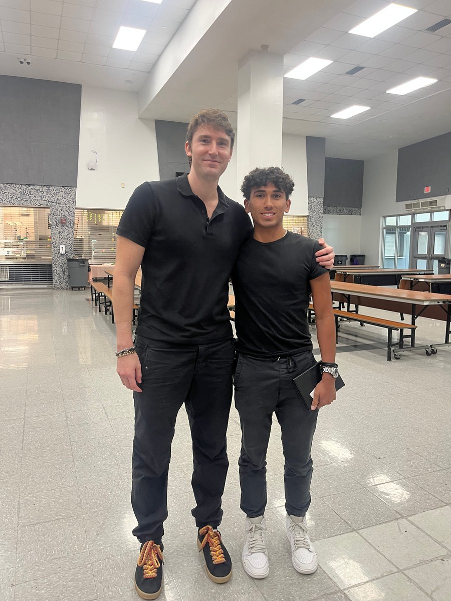 Ivan Soto-Wright with a student at Alonzo and Tracy Mourning Senior High School