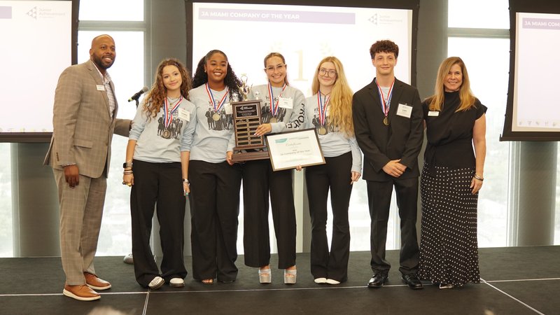 JA Miami students celebrating on stage
